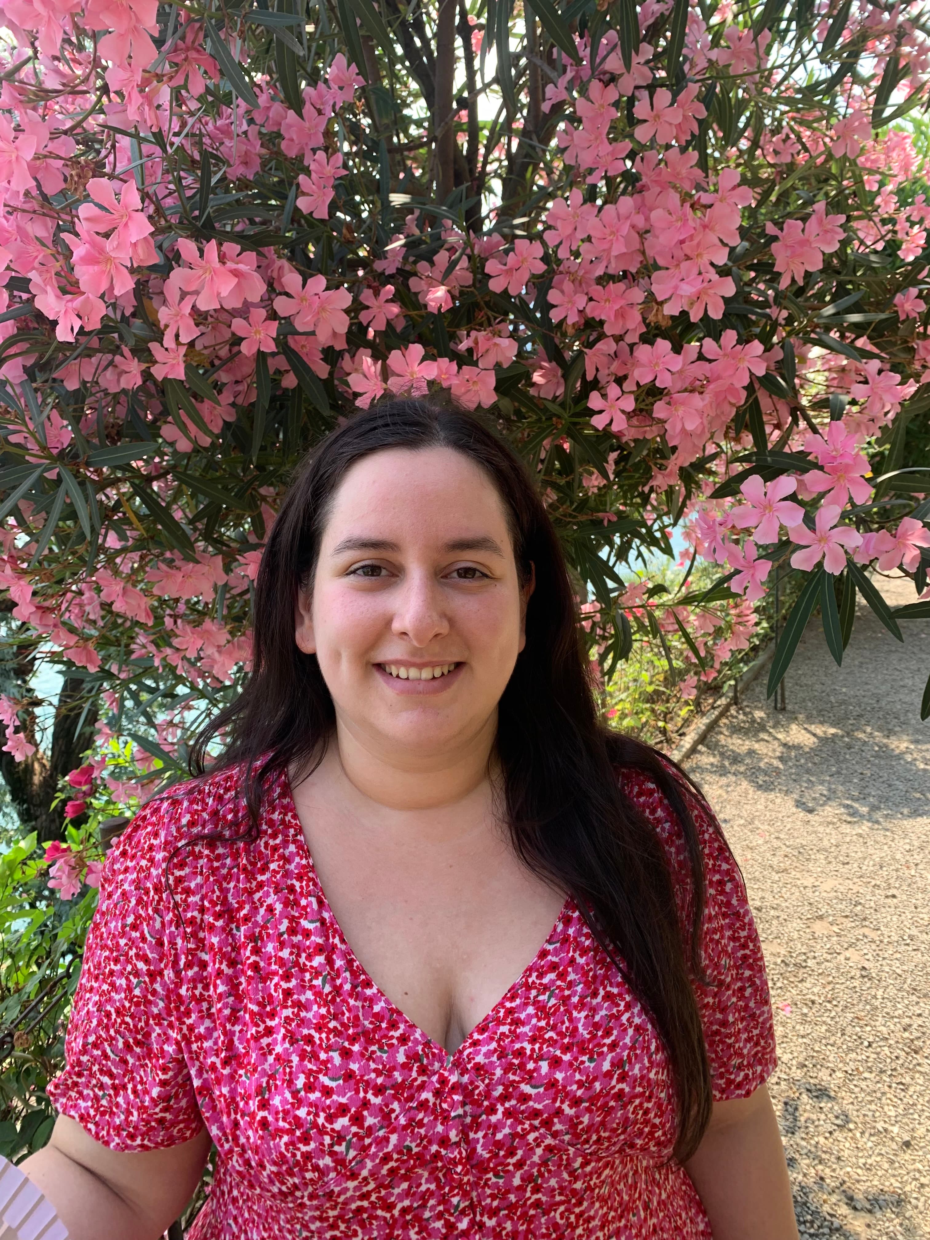 Picture of myself with a pink blossomed tree background